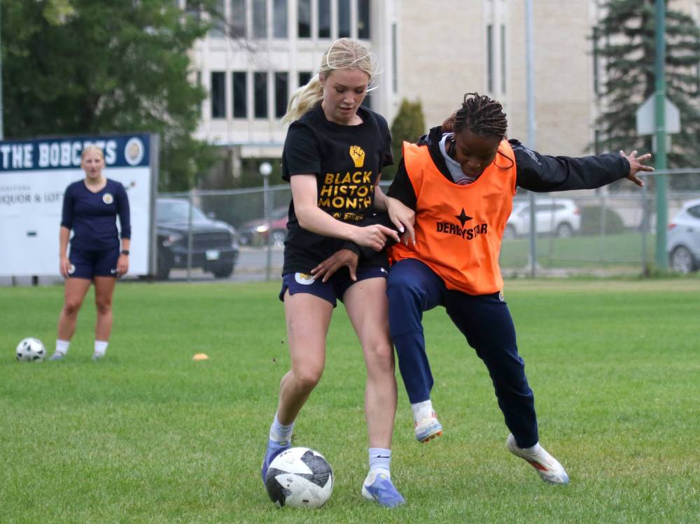 Abby-Jo Wark, left, and Keashae Masters battle for the ball during Brandon University Bobcats women’s soccer practice at the Healthy Living Centre field on Wednesday. (Thomas Friesen/The Brandon Sun)