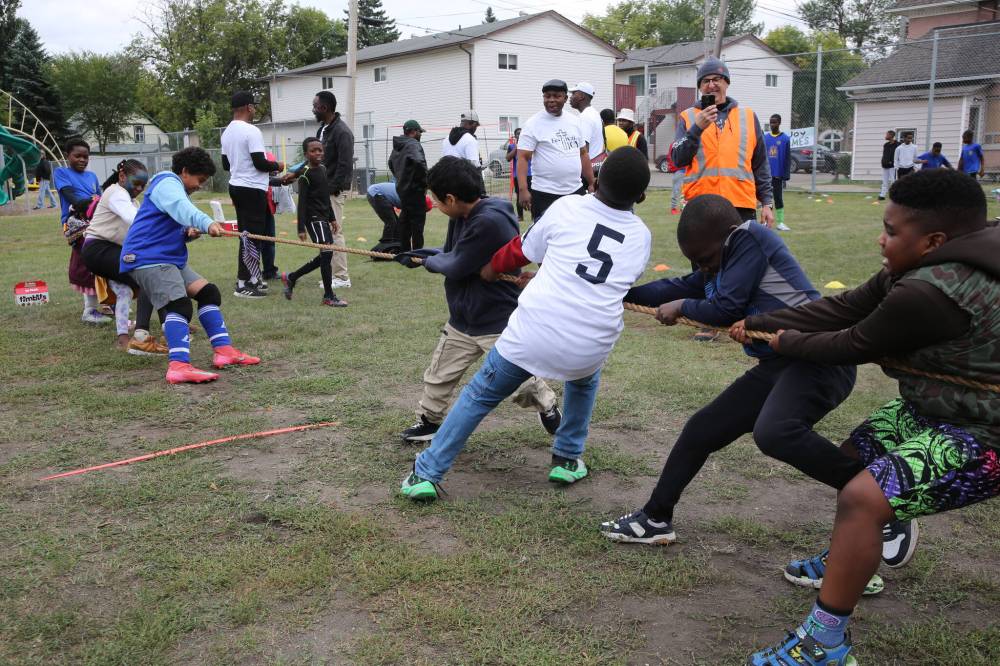 Children play a tug of war contest during the St. Augustine Catholic Church Brandon’s annual Festival of Joy on Saturday afternoon at the parish grounds. (Abiola Odutola/The Brandon Sun)