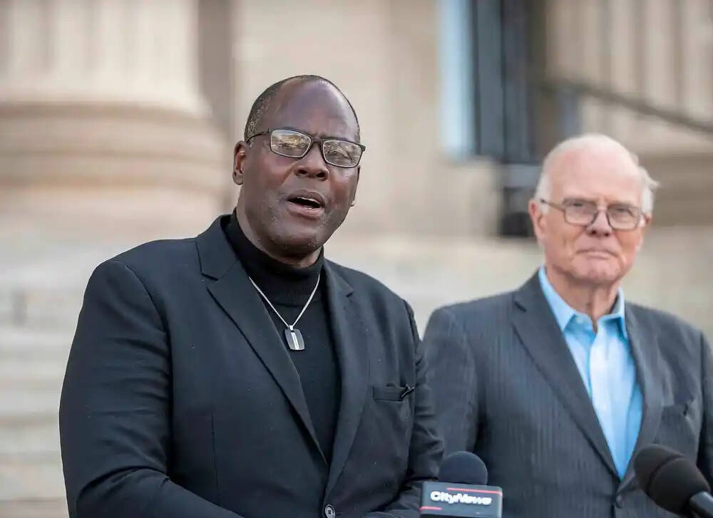 Former Winnipeg Blue Bombers running back Willard Reaves, 66, (left) announces his intention to run for leader of the Manitoba Liberal Party as former party leader and former MLA for River Heights Jon Gerrard looks on Sunday afternoon. (Brook Jones/Winnipeg Free Press)