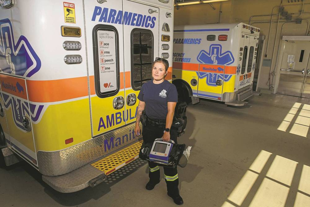 Rebecca Clifton, paramedic and administrative director of the Paramedic Association of Manitoba, stands in front of an ambulance at the Selkirk Regional Health Centre. (Winnipeg Free Press files)