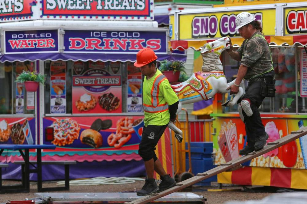 A work crew with Select Shows unloads one of 30 carousel horses during a Thursday afternoon midway set up. Select Shows will hold its final show in Brandon this season, starting today for the Fall Fair at the Keystone Centre grounds. Gates open at 5 p.m. (Photos by Matt Goerzen/The Brandon Sun)