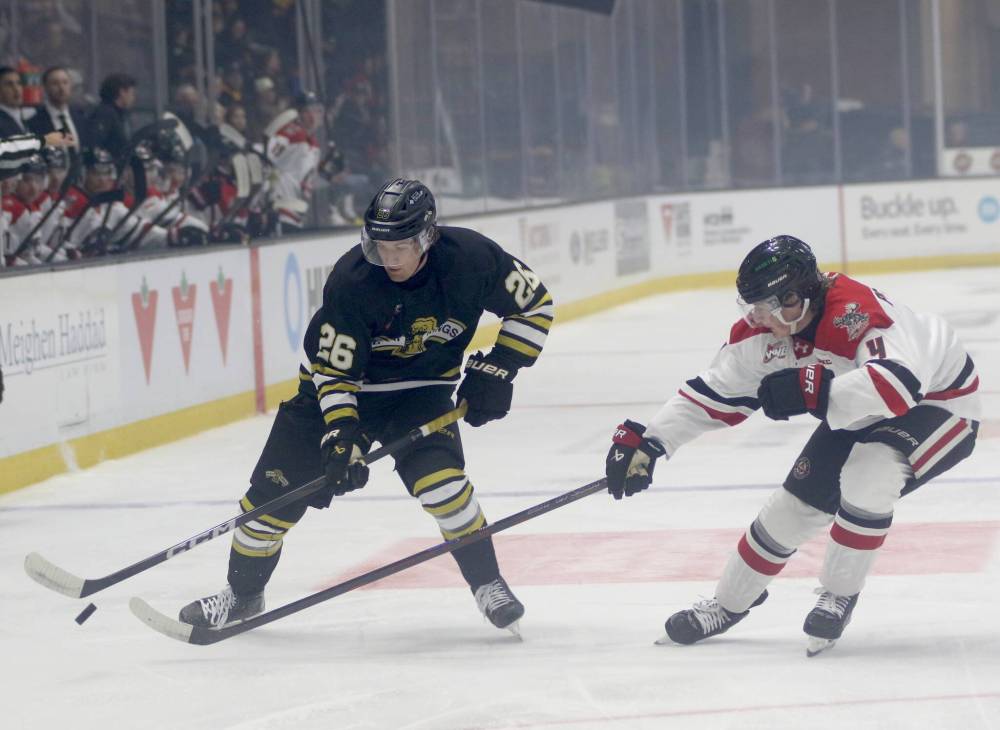 Brandon Wheat Kings Luke Mistelbacher carries the puck as Moose Jaw’s Nolan Pacquette defends during their WHL season opener at Assiniboine Credit Union Place on Friday. (Thomas Friesen/The Brandon Sun)