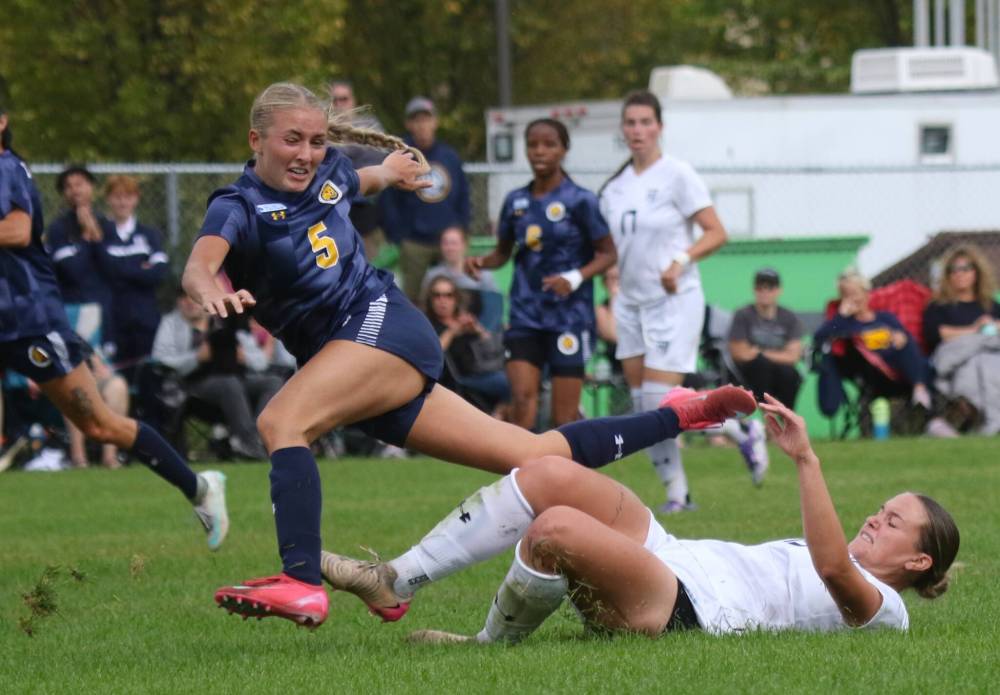 Brandon University Bobcats Brogan Henry, left, goes down after a hard, clean tackle against the Providence Pilots on Saturday. (Thomas Friesen/The Brandon Sun)
