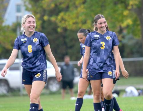 Laure Dizengremel (3) smiles with Mackenzie Boyes (8) after scoring the first goal of her Manitoba Colleges Athletic Conference career in a 4-2 Brandon University Bobcats victory over the Providence Pilots at the Healthy Living Centre field on Saturday. (Thomas Friesen/The Brandon Sun)