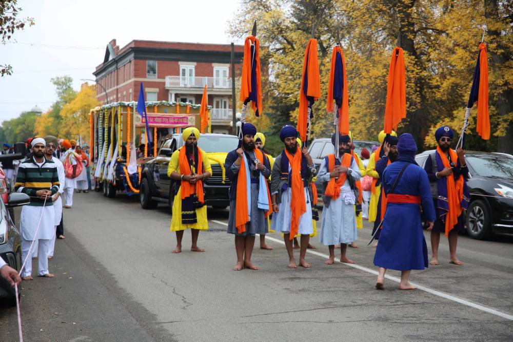 The Nagar Kirtan procession carried the Sikh holy scripture through downtown, filling the streets with devotional singing before returning to Stanley Park.