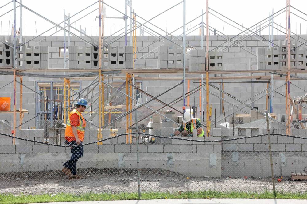 A worker walks on the construction site at Maryland Park School in Brandon on Tuesday. (Tim Smith/The Brandon Sun)