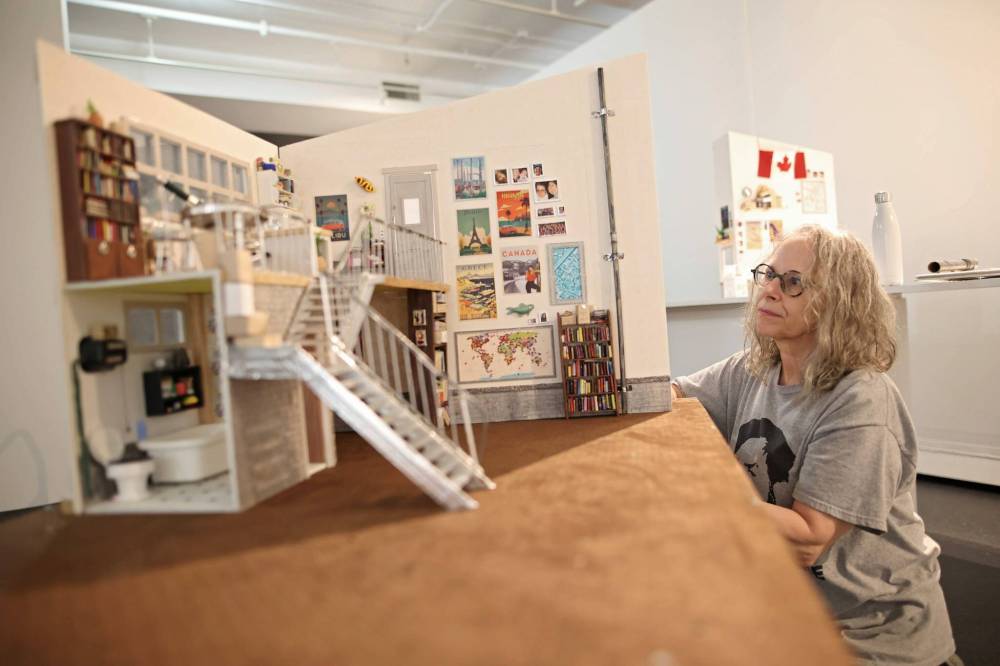 Artist Anita Lebeau assembles her exhibit called “Sara and Sunny’s Pad” on Wednesday at the gallery. (Tim Smith/The Brandon Sun)