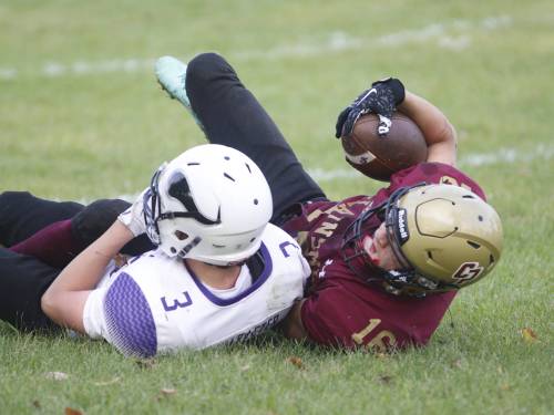 Kayven Brown (#16) gets taken down by Lexan White (#3) after a 10-yard reception during junior varsity football action at Crocus on Wednesday. (Massimo De Luca-Taronno/The Brandon Sun)