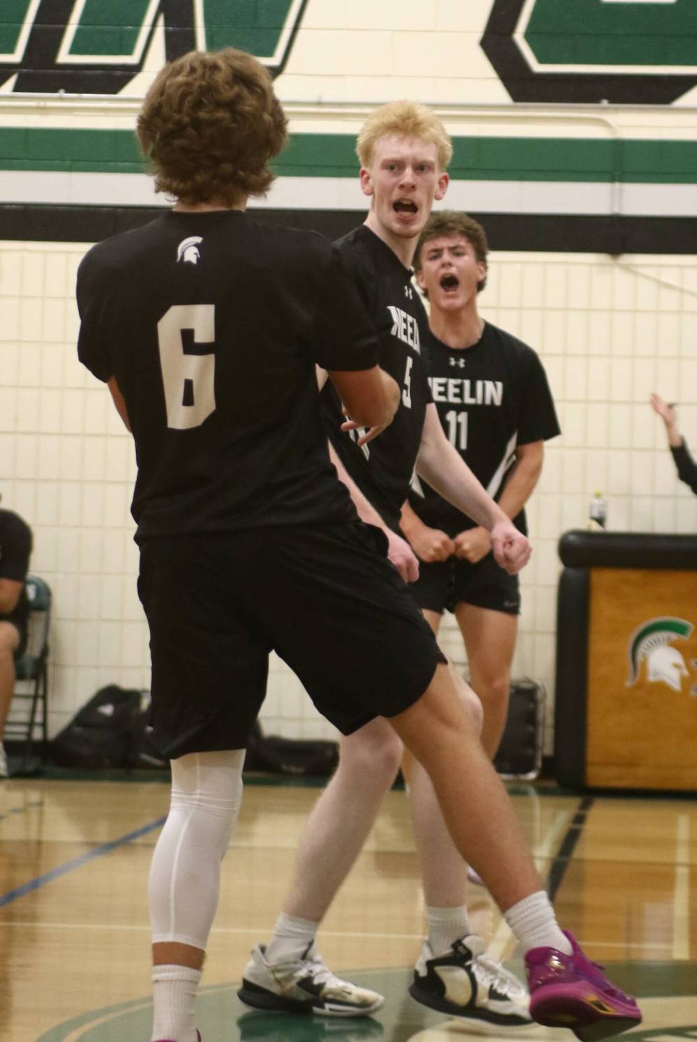 Sam Rempel, centre, celebrates a point with setter Aiden Moore (6) and Lucas Gamache. (Thomas Friesen/The Brandon Sun)