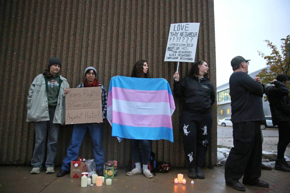 A group of about 20 protesters, many of them students from Brandon University, held a counter-vigil on the south side of Princess Avenue for the first 20 minutes of the vigil for Charlie Kirk, holding signs in support of LGBTQ2 communities, minorities and immigrant populations. Several passing motorists honked their horns as they drove past in support of the counter-vigil, which drew cheers from the group.
