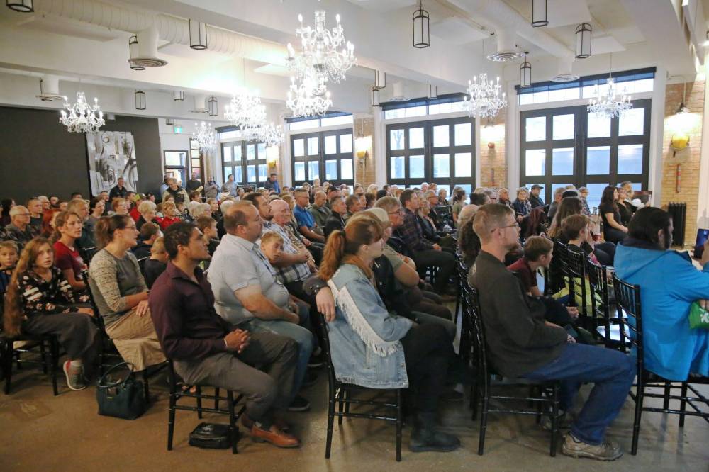 Mourners and supporters attend Friday’s candlelight vigil at the Firehall Event Venue on Princess Avenue in Brandon.