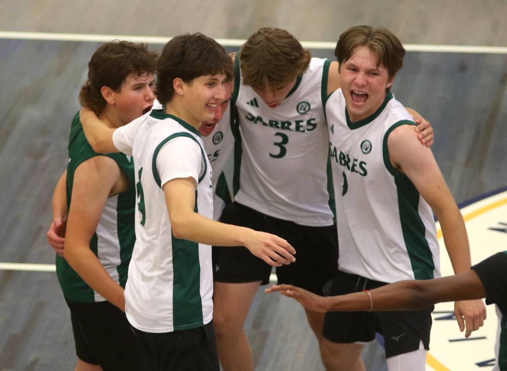 The Elton Sabres celebrate their three-set win over the Neelin Spartans to finish in fifth place. (Thomas Friesen/The Brandon Sun)