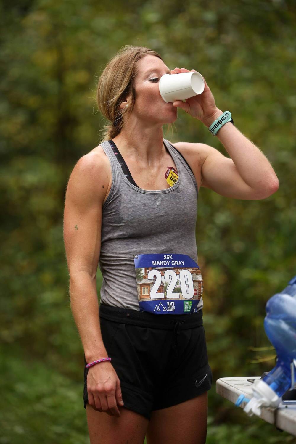 Mandy Gray hydrates at an aid station while competing in the 25 km category of the Epic East Gate trail run at Riding Mountain National Park on Saturday. Gray placed first in the women’s 25 km category. Approximately 165 runners entered the 50 km, 25 km or 10 km categories. The annual trail run began in 2018. All runners earned medals and the top three male and female runners in each category earned trophies. All profits from the run are donated to active living initiatives.