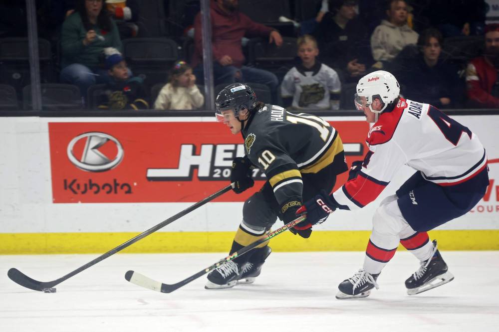 Brandon Wheat Kings forward Caleb Hadland (10), shown protecting the puck from Lethbridge Hurricanes defenceman Carsen Adair (4) last November, scored a career-high 25 goals last season. (Tim Smith/The Brandon Sun)