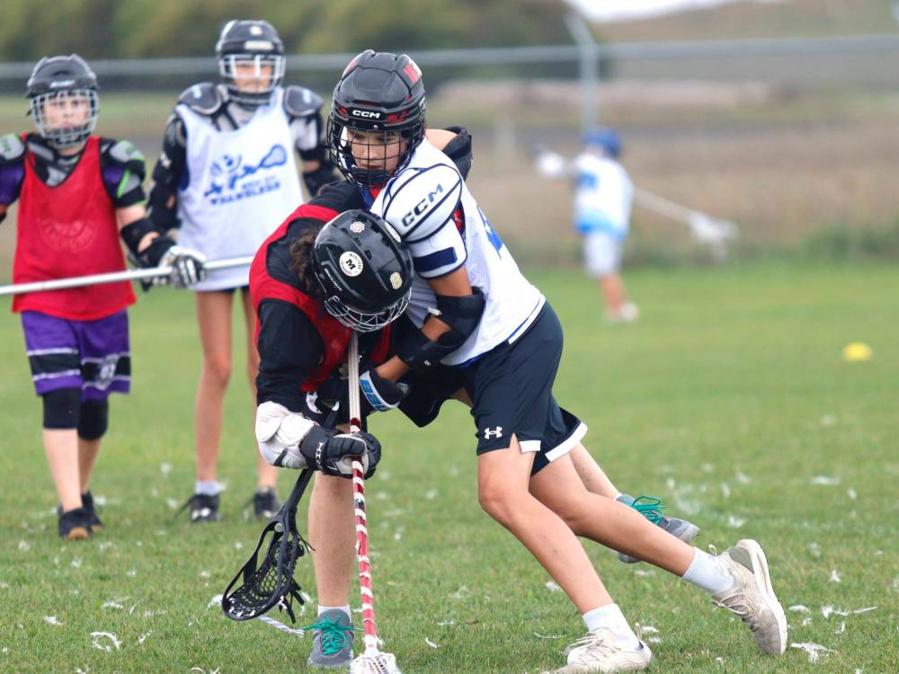 Wranglers attacker Waylon Diamond (#16) takes the body during U13 Wheat City field lacrosse action against the Southman Saints at Simplot Millennium Park on Saturday. (Massimo De Luca-Taronno/The Brandon Sun)