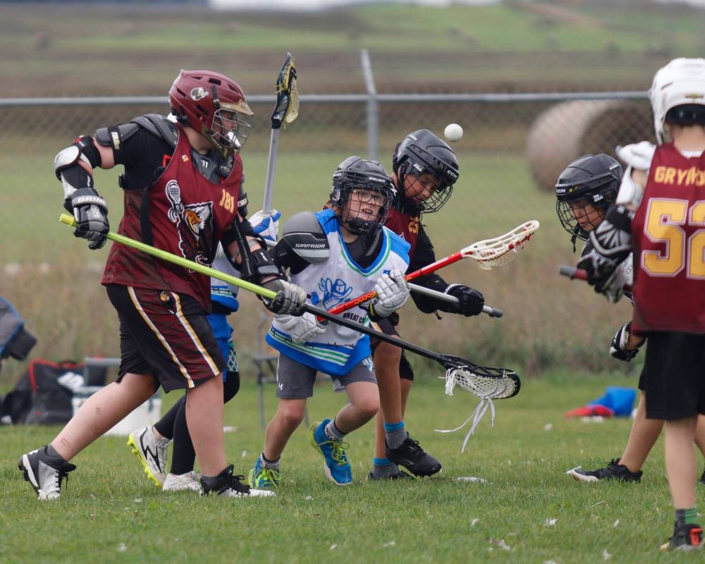 Myles Mott (#70), 9, locates the ball amid a wave of bodies during the Wranglers U11 field lacrosse game. (Massimo De Luca-Taronno/The Brandon Sun)