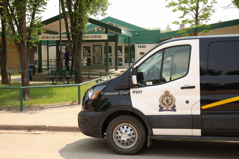 A Brandon police vehicle sits parked in front of École secondaire Neelin High School on June 10 after a violent attack inside the school. (Tim Smith/The Brandon Sun files)