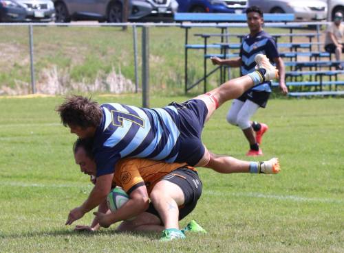 Richard Pierreroy of the Brandon Barbarians tackles Cole Scott of the Manitoba Wombats in Premier Men&rsquo;s Division 2 action at John Reilly Field on Saturday afternoon. (Perry Bergson/The Brandon Sun)