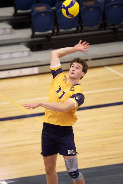 Liam Kindle (11) of the Brandon Bobcats leaps to put the ball over the net during university men’s pre-season volleyball action against the University of Winnipeg Wesmen at the BU Healthy Living Centre on Friday evening. (Tim Smith/The Brandon Sun)