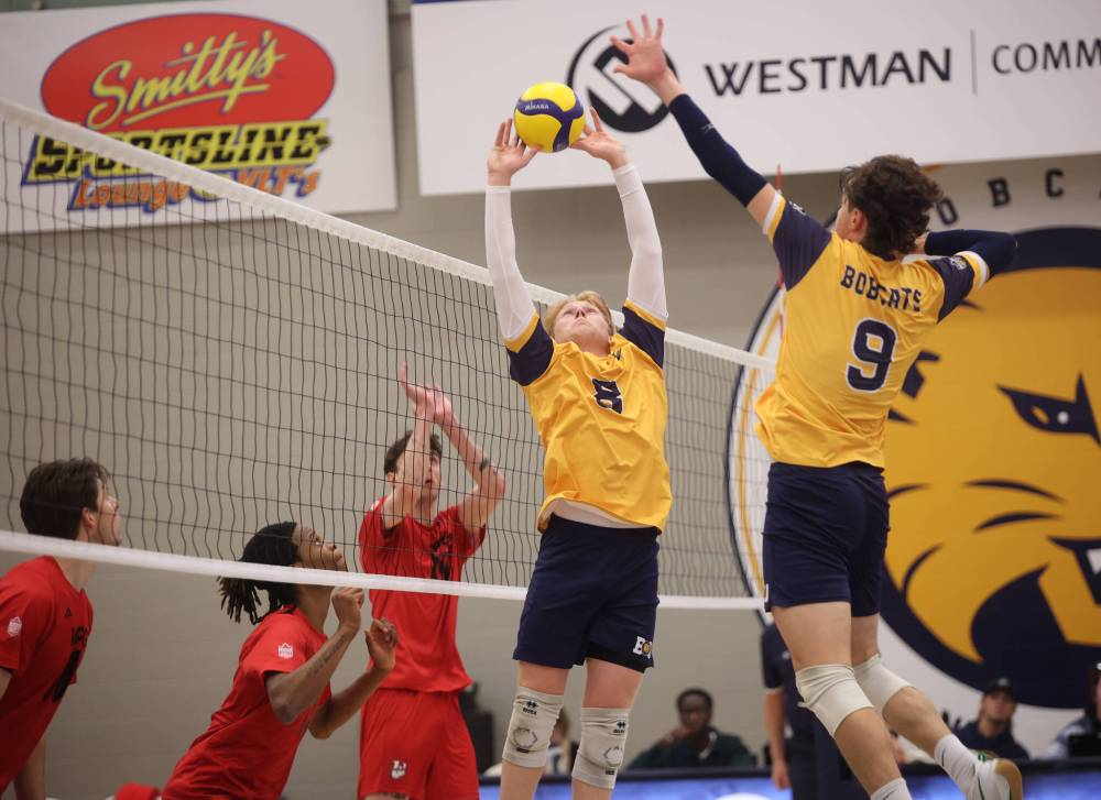 Kale Fisher (8) of the Brandon Bobcats sets the ball for Riley Brunet (9) during university men's pre-season volleyball action against the University of Winnipeg Wesmen at the BU Healthy Living Centre on Friday evening.
(Tim Smith/The Brandon Sun)