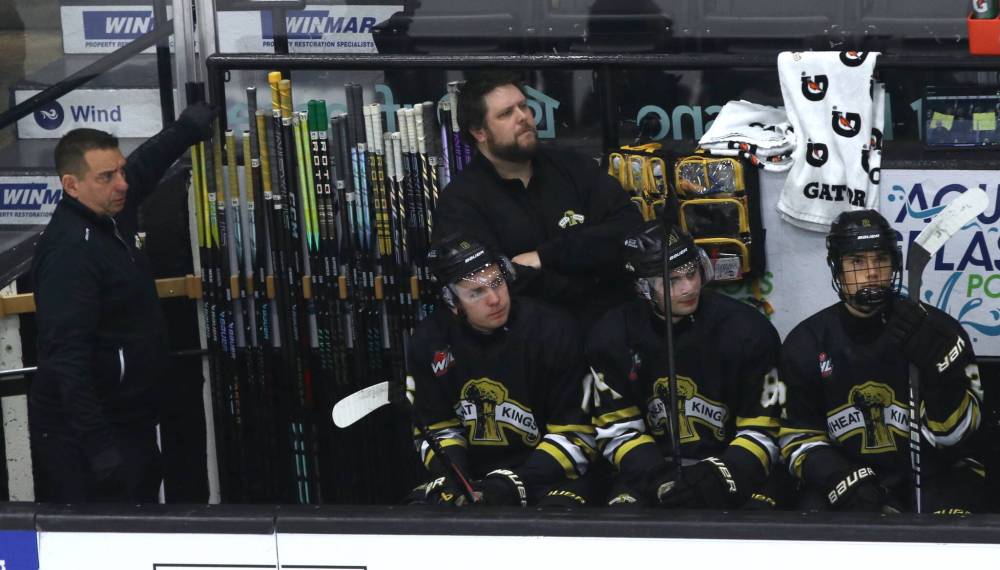 Wheat Kings equipment manager Jake McKercher, with equipment assistant Rob Pope to his left, stands near the sticks during the team’s 5-4 overtime loss to the visiting Prince Albert Raiders on Saturday. (Perry Bergson/The Brandon Sun)