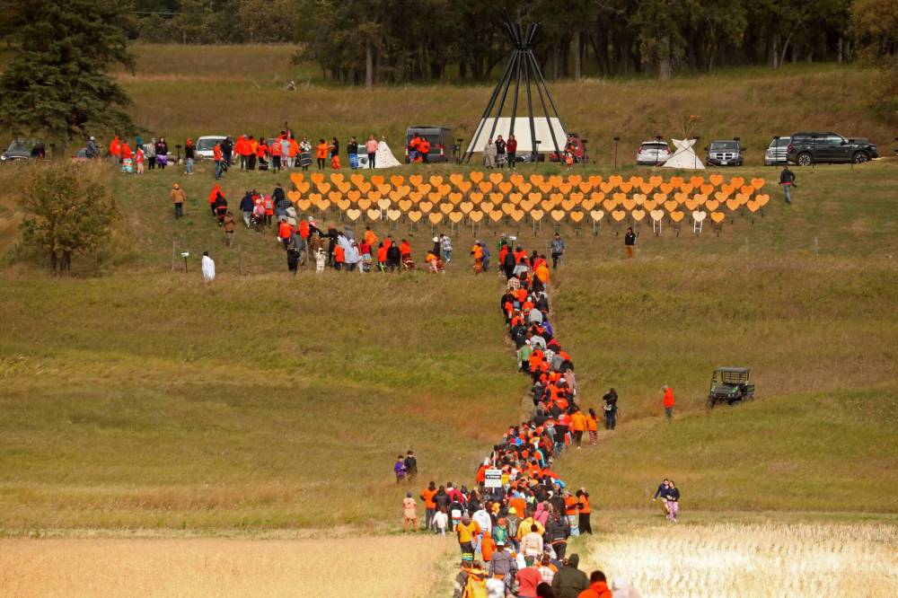 Participants make their way from Grand Valley Road across a field to the former Brandon Residential School site during the Truth and Reconciliation Week 2024 Orange Shirt Day Walk. École secondaire Neelin High School columnist Abby Wronowski writes that taking part in this year’s walk is one way to honour truth and reconciliation with Indigenous Peoples, but there are many others. (Tim Smith/The Brandon Sun files)