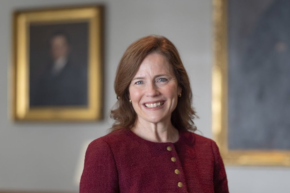 Supreme Court Associate Justice Amy Coney Barrett poses for a photo during an interview with The Associated Press, prior to the release of her new book,