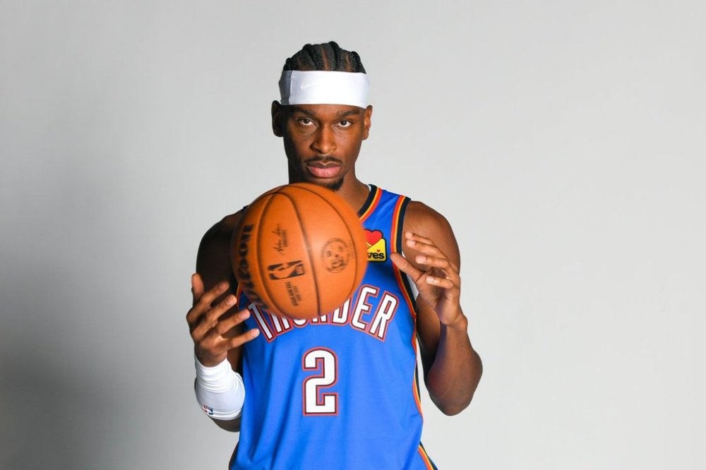 Oklahoma City Thunder guard Shai Gilgeous-Alexander poses for a photo during the NBA basketball team's media day, Monday, Sept. 29, 2025, in Oklahoma City. (AP Photo/Kyle Phillips)