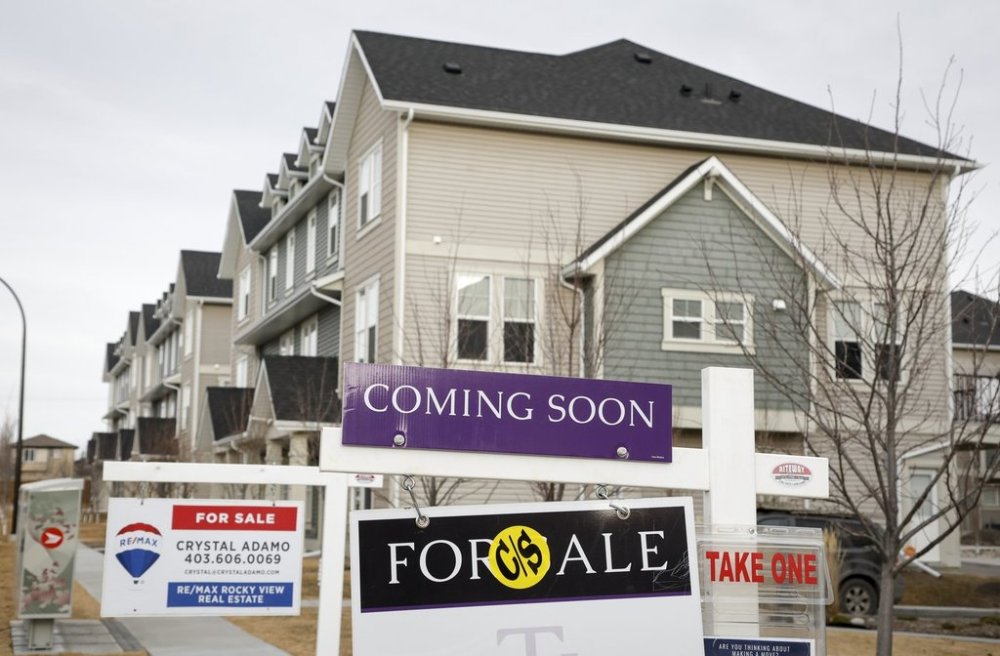Houses for sale in a new subdivision in Airdrie, Alta., Friday, Jan. 28, 2022. THE CANADIAN PRESS/Jeff McIntosh