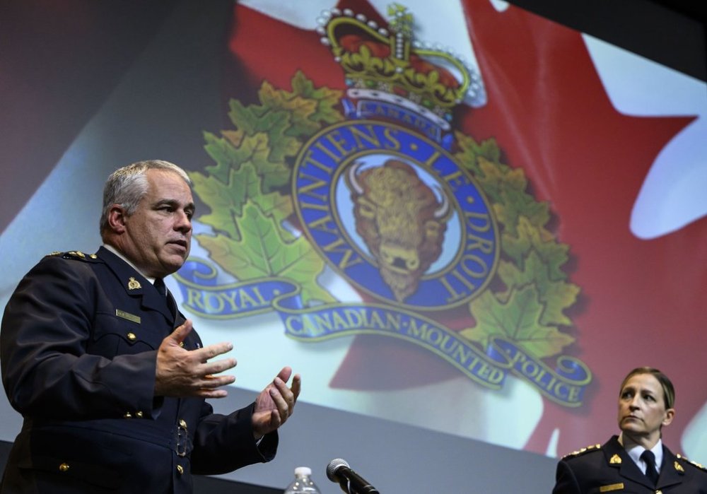 RCMP Commissioner Mike Duheme, left, speaks as he concludes a news conference with Assistant Commissioner Brigitte Gauvin, right, at RCMP National Headquarters in Ottawa on Monday, Oct. 14, 2024. THE CANADIAN PRESS/Justin Tang