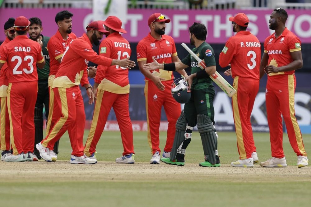 Players of both teams greet each other at the end of the ICC Men's T20 World Cup cricket match between Pakistan and Canada at the Nassau County International Cricket Stadium in Westbury, New York, Tuesday, June 11, 2024. (AP Photo/Adam Hunger)