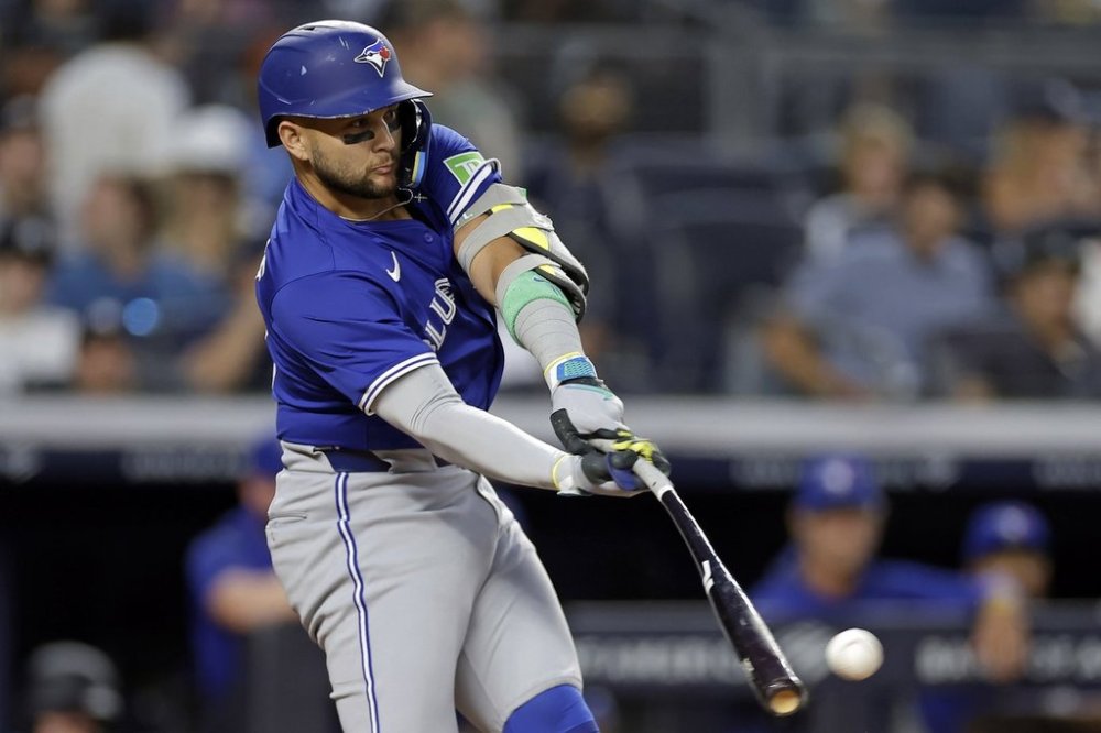 Toronto Blue Jays' Bo Bichette hits a run-scoring double during the first inning of a baseball game against the New York Yankees, Friday, Sept. 5, 2025, in New York. (AP Photo/Adam Hunger)