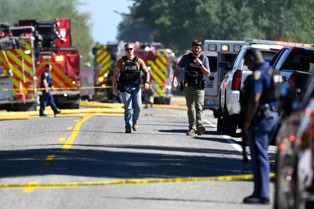 Law enforcement guard the area along McCandlish Road near a shooting that took place at The Church of Jesus Christ of Latter-day Saints, Sunday, Sept. 28, 2025, in Grand Blanc, Mich. (AP Photo/Jose Juarez)
