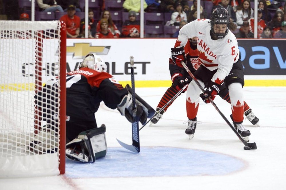 Canada forward Rebecca Johnston (6) takes a shot on Japan goaltender Miyuu Masuhara (30) during second period IIHF Women's World Hockey Championship hockey action in Brampton, Ont., on Saturday, April 8, 2023. THE CANADIAN PRESS/Cole Burston