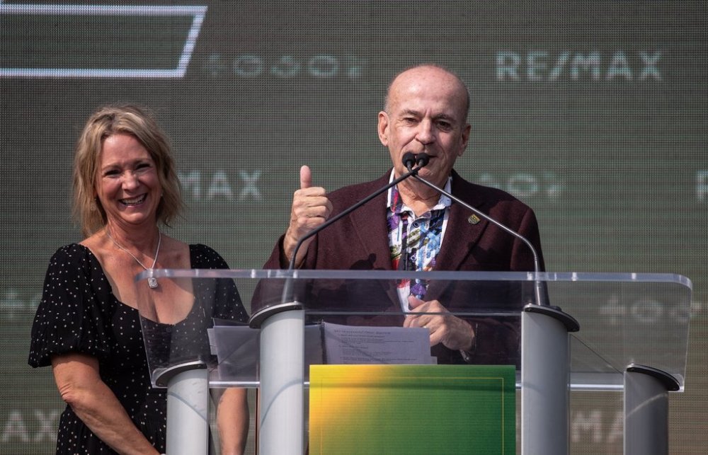 CFL Edmonton Elks new owner Larry Thompson and his wife Deb Thompson speak during a press conference in Edmonton, Alta., on Thursday August 15, 2024. THE CANADIAN PRESS/Jason Franson
