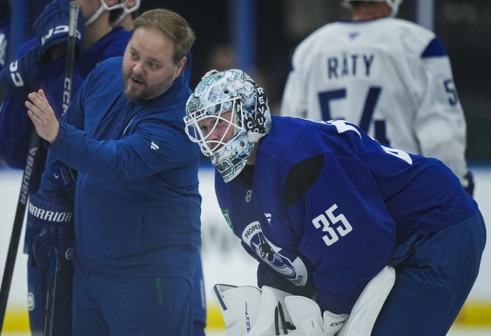 Vancouver Canucks' Thatcher Demko listens to goaltending coach Marko Torenius during the opening day of the NHL hockey team's training camp, in Penticton, B.C., on Thursday, September 18, 2025. THE CANADIAN PRESS/Darryl Dyck