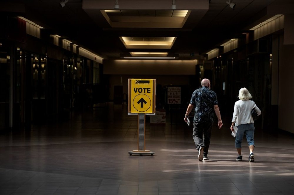 Voters head to the voting station for the Battle River-Crowfoot byelection in Camrose, Alta., Monday, Aug. 18, 2025. In Alberta, voters can show their driver's licence or provincial ID card as their one piece of ID. But they may also show two pieces of ID, such as a passport and a bank statement. THE CANADIAN PRESS/Jason Franson