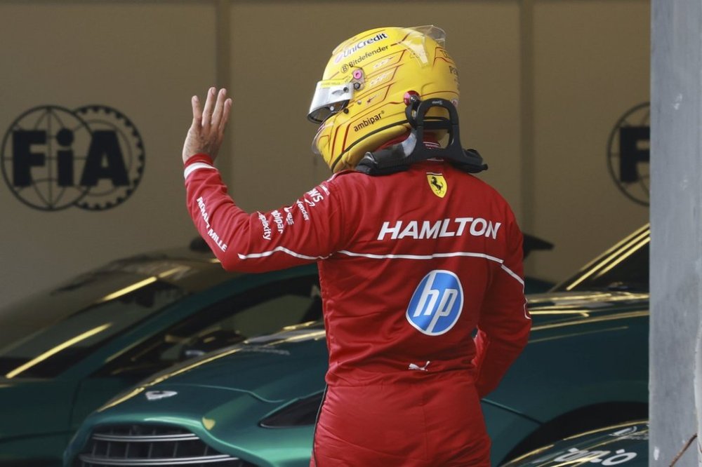 Ferrari driver Lewis Hamilton of Britain waves during the qualifying for the Azerbaijan Formula One Grand Prix in Baku, Azerbaijan, Saturday, Sept. 20, 2025. (AP Photo/Anton Vaganov, Pool)