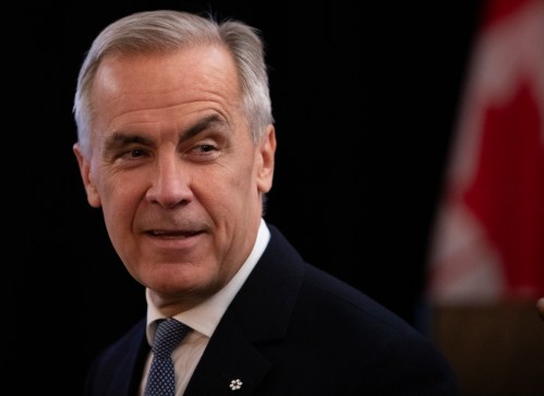 Prime Minister Mark Carney greets party members as he arrives to deliver remarks at the Liberal caucus in Edmonton on Wednesday September 10, 2025.  THE CANADIAN PRESS/Amber Bracken