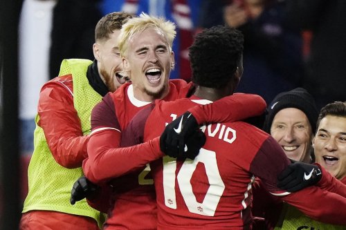 Canada's Jonathan David (10) celebrates his goal against Panama with Liam Millar during men's international friendly soccer action in Toronto, on Tuesday, October 15, 2024. Canada continues its rise under coach Jesse Marsch, jumping three spots to No. 35 in the latest FIFA world rankings.THE CANADIAN PRESS/Frank Gunn