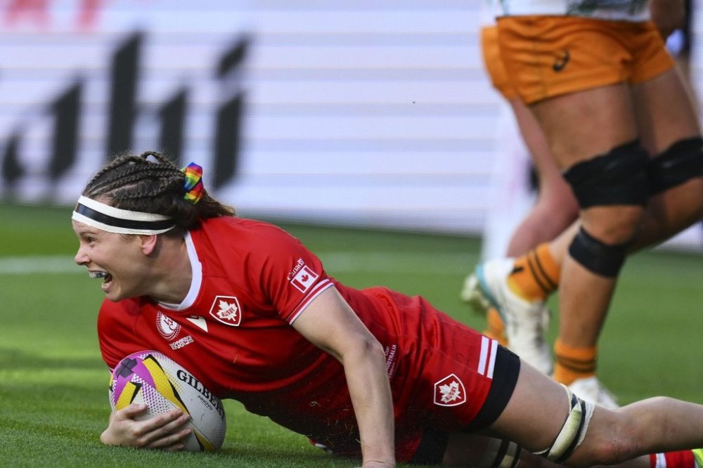 Canada's Karen Paquin celebrates after scoring a try during the Women's Rugby World Cup 2025 quarterfinal match between Canada and Australia, in Bristol, England, Saturday, Sept. 13, 2025. (AP Photo/Anthony Upton)