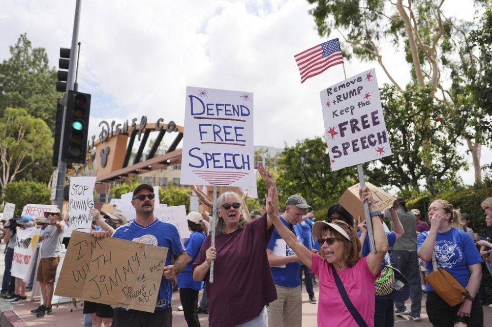 Demonstrators picket in response to the cancellation of Jimmy Kimmel's late-night show outside of The Walt Disney Studios Thursday, Sept. 18, 2025, in Burbank, Calif. (AP Photo/Jae C. Hong)