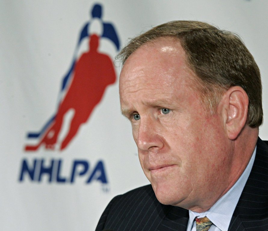 Bob Goodenow listens to a question during a news conference in Toronto, Thursday July 28, 2005. Goodenow, who'd held the post of NHL Players' Association executive director for 13 years and led players through two long work stoppages, has died. (CP PHOTO/Adrian Wyld)