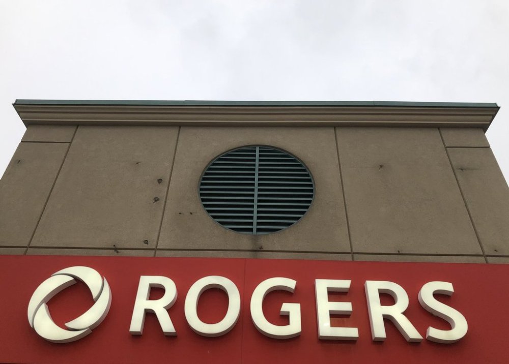 Rogers store signage shown in Mississauga, Ont., Monday, Dec.16, 2024. Rogers Communications Inc. is expanding its satellite-to-mobile text messaging service across bodies of water and along waterways off the Canadian coastline. THE CANADIAN PRESS/Richard Buchan