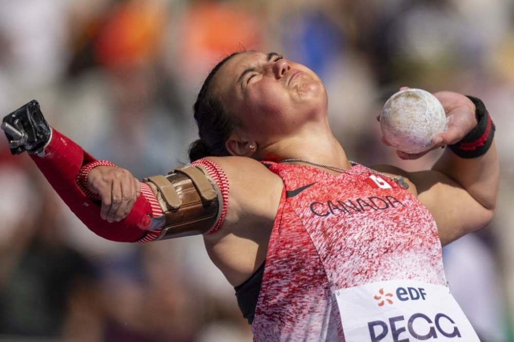 Katie Pegg, of Canada, competes in the Women's Shot Put F46 Final, at the Stade de France stadium, during the 2024 Paralympics, Wednesday, Sept. 4, 2024, in Paris, France. (AP Photo/Emilio Morenatti)