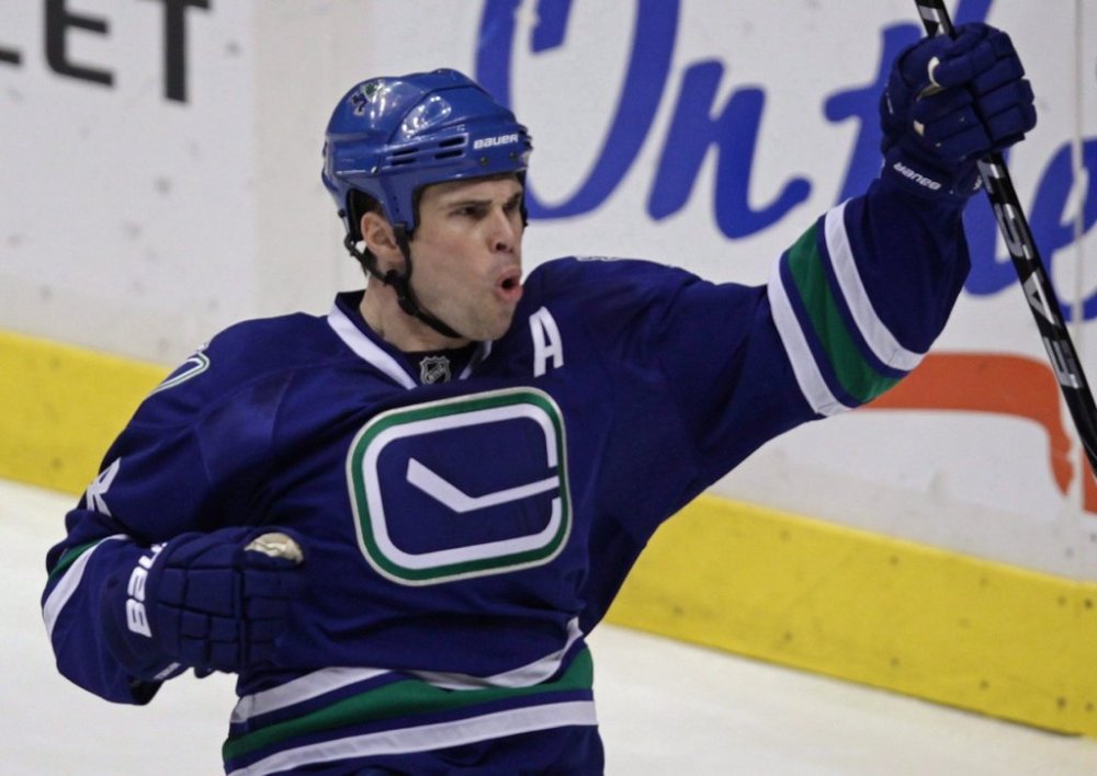 Vancouver Canucks' Willie Mitchell celebrates his goal against the Pittsburgh Penguins during second period NHL action in Vancouver, B.C., on Jan. 16, 2010. The Los Angeles Kings have agreed to terms on a two-year contract with unrestricted free agent defenceman Willie Mitchell. THE CANADIAN PRESS/Darryl Dyck