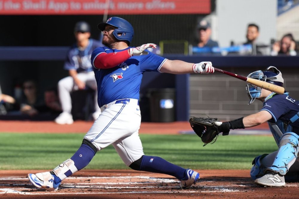 Blue Jays catcher Alejandro Kirk hits a grand slam against the Tampa Bay Rays during the first inning of a Major League Baseball game in Toronto on Sept. 28, 2025. THE CANADIAN PRESS/Chris Young