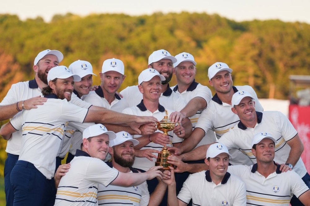Europe poses with the trophy after winning the Ryder Cup golf tournament against the United States on the Bethpage Black golf course, Sunday, Sept. 28, 2025, in Farmingdale, N.Y. (AP Photo/Lindsey Wasson)