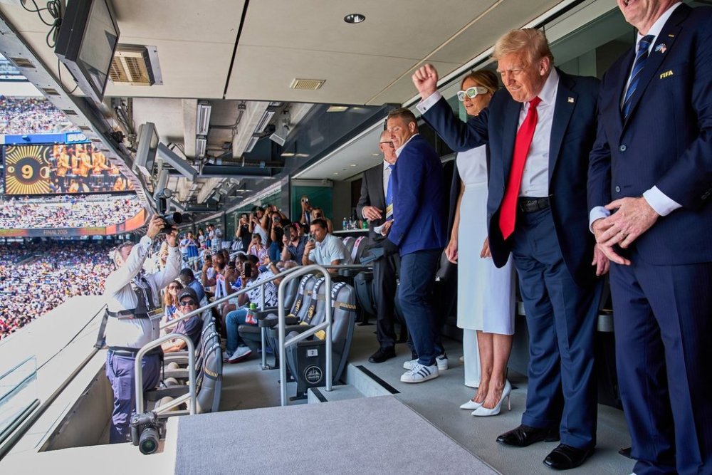 FILE - President Donald Trump, from right, pumps his fist as he and first lady Melania Trump look to the crowd while attending the Club World Cup final soccer match, at MetLife Stadium in East Rutherford, N.J., July 13, 2025. (AP Photo/Jacquelyn Martin, File)
