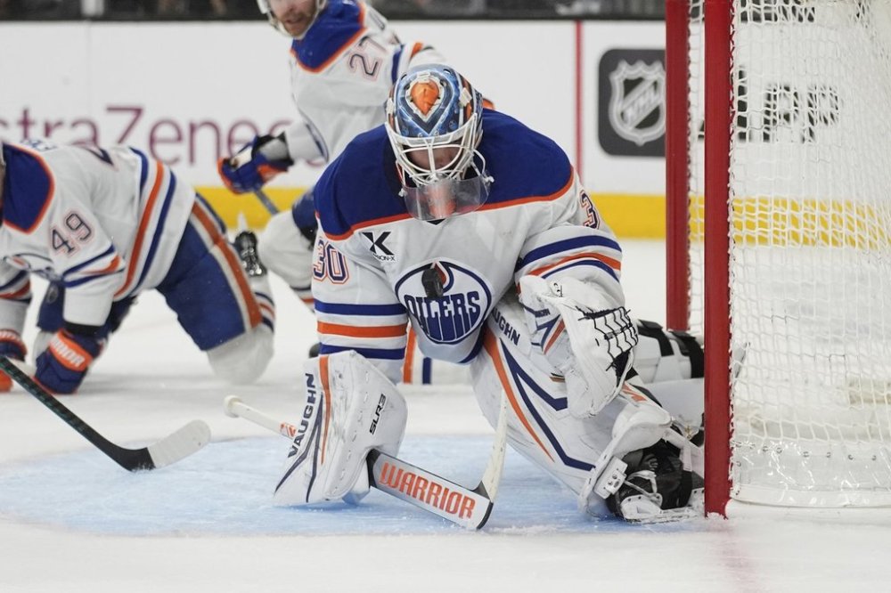 Edmonton Oilers goaltender Calvin Pickard (30) makes a save against the Vegas Golden Knights during the second period of Game 2 of a second-round NHL hockey playoff series Thursday, May 8, 2025, in Las Vegas. (AP Photo/John Locher)